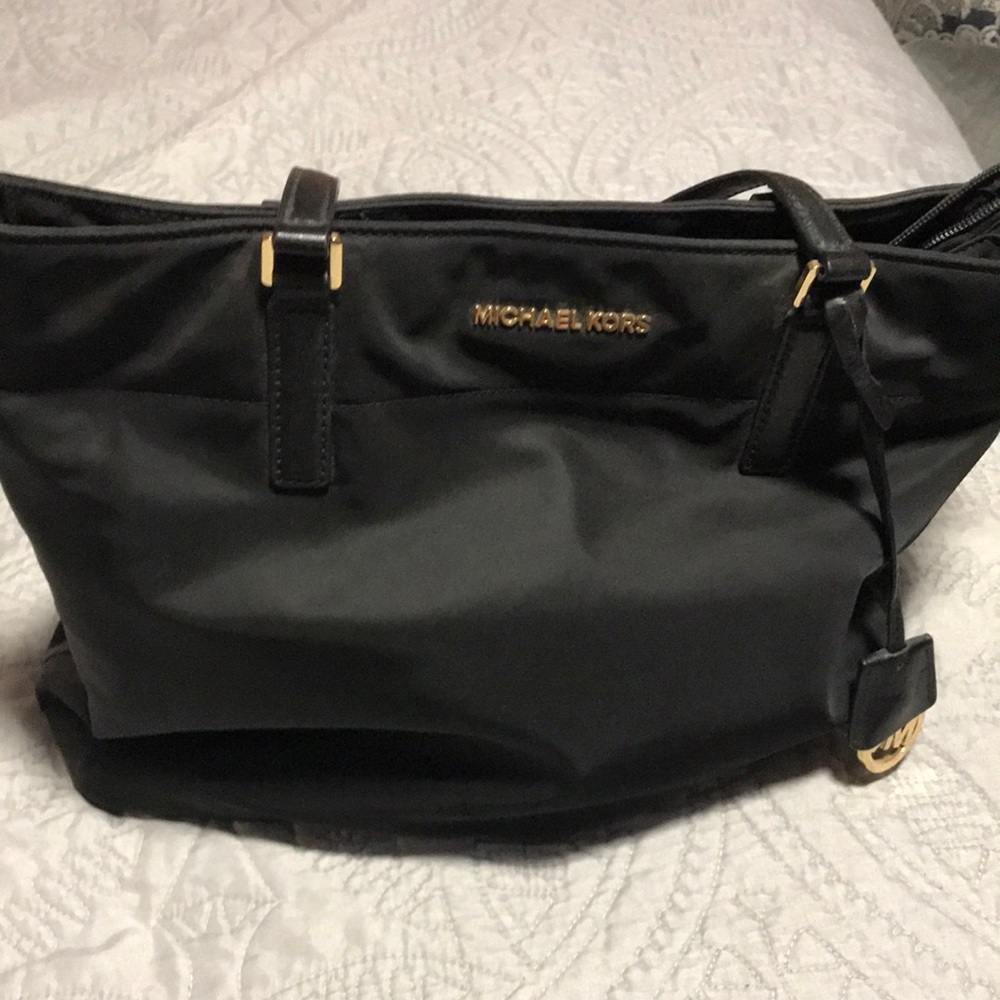This is a Vinyl black bag